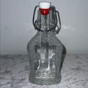 Clear Glass Liquor Bottle with Red and White Stopper From W Germany